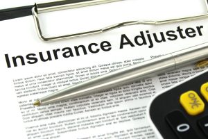 picture of insurance adjuster paperwork.
