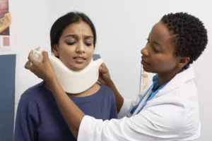 Car Accident Whiplash Victim Wearing A Cervical Collar For Whiplash.