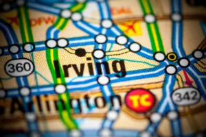 Close-Up Of A Road Map Highlighting Irving, Texas—Representing The Service Area Of An Irving Personal Injury Attorney.