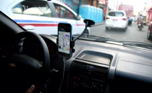 View From Inside A Rideshare Vehicle Using A Gps App While Navigating City Traffic, Representing The Types Of Cases Handled By A Fort Worth Lyft Accident Lawyer.