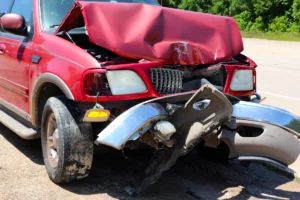 A Red Suv With Severe Front-End Damage After A Collision, Representing The Types Of Crash Cases A Fort Worth Car Accident Lawyer Handles For Injured Victims Seeking Compensation.