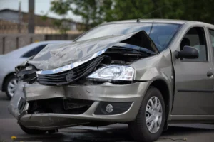 Damaged Front End Of A Car With Severe Crash Impact, Representing The Aftermath Of A Deadly Collision Often Handled By A Dallas Fatal Car Crash Lawyer.
