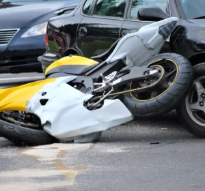 Yellow Motorcycle Damaged In A Collision With A Car, Representing The Need For An Irving Motorcycle Accident Attorney To Help Injured Riders Seek Justice