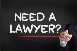 Need A Lawyer? Text On A Blackboard With A Person In A Suit Drawing A Red Underline. Learn How Can A Truck Accident Lawyer Help With Your Case.