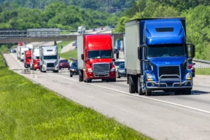 Highway Traffic With Multiple Semi-Trucks And Cars In Motion, Illustrating The Dangers Handled By A Duncanville Truck Accident Lawyer.