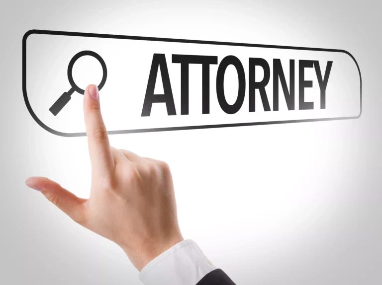 A person pointing at a digital search bar with the word “Attorney” and a magnifying glass icon, representing the search for legal help and asking the question is it worth getting an attorney for a car accident.