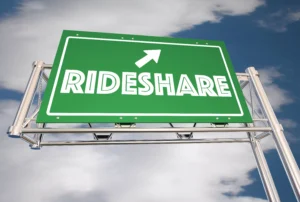 Green Highway Sign With The Word “Rideshare” And An Upward Arrow, Representing Transportation Options Relevant To A Lancaster Rideshare Accident Lawyer.