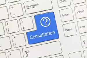 Keyboard With Blue Key Labeled “Consultation” And Question Mark Symbol, Representing The Concept Of How Much Is A Lawyer Consultation Fee.