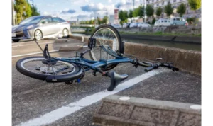 Damaged Bicycle On The Road After A Collision In Irving Tx Highlighting The Need For An Irving Bike Accident Lawyer
