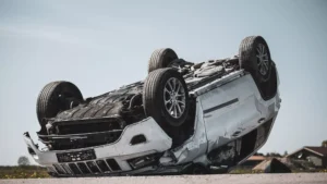 Vehicle Overturned In A Serious Crash, Showing Damage And Debris—Scene Relevant To A Rollover Accident Lawyer Case In Texas