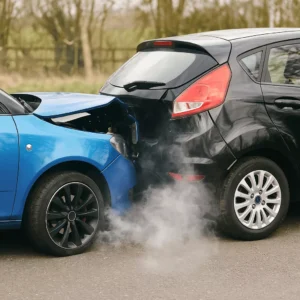 Two Cars With Visible Bumper Damage After A Rear-End Collision On A Suburban Road, Illustrating The Type Of Crash Handled By A Cedar Hill Rear End Accident Lawyer.