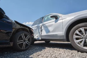 T-Bone Car Accident Lawyer Representing Victims After A Side-Impact Crash Between A Black Car And A White Suv With Severe Door Damage.